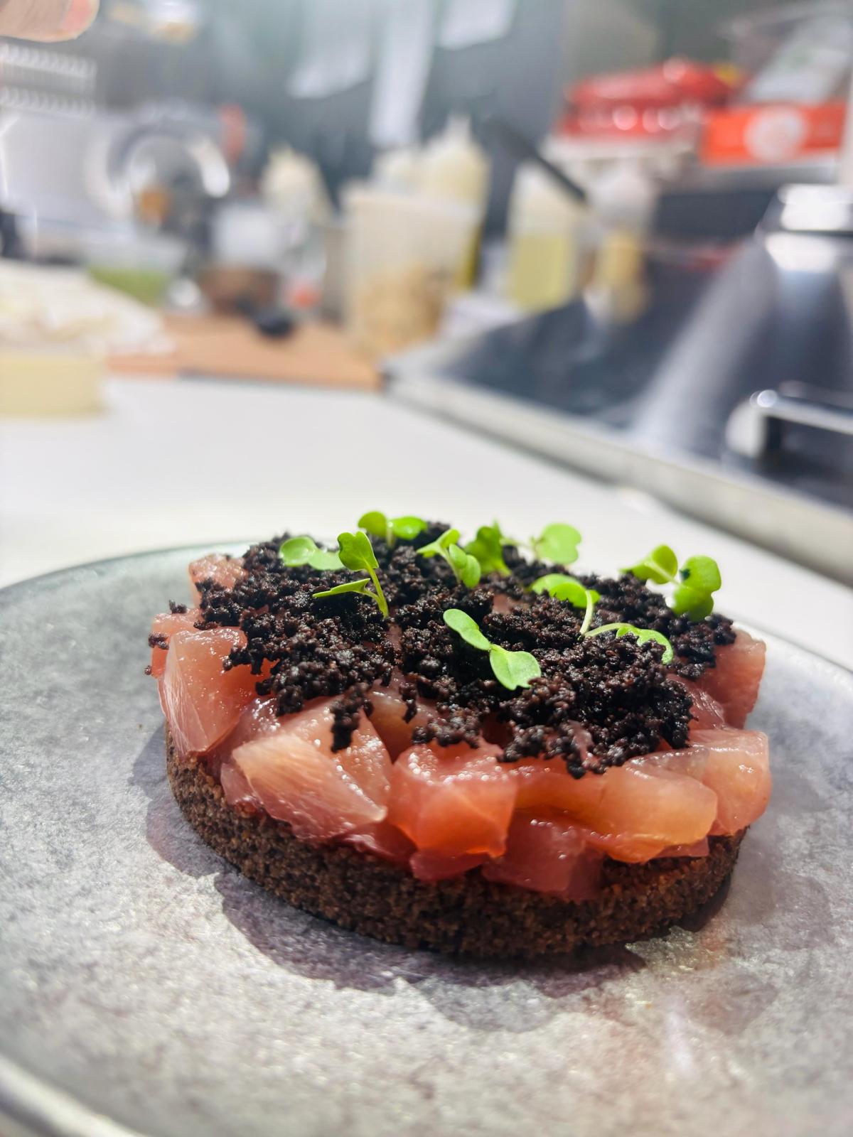 Tuna crostino with black crumb